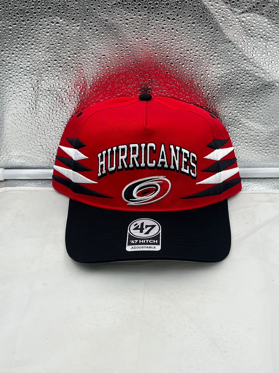 Carolina Hurricanes NHL '47 Brand Red Diamond Hitch Adjustable Snapback Hat in vibrant red color, showcasing team logo and stylish snapback design.