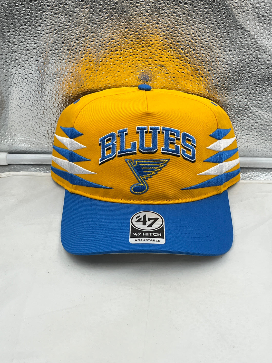 St Louis Blues NHL '47 Brand Gold Diamond Hitch Adjustable Snapback Hat showcasing its stylish design and adjustable fit, perfect for hockey fans.
