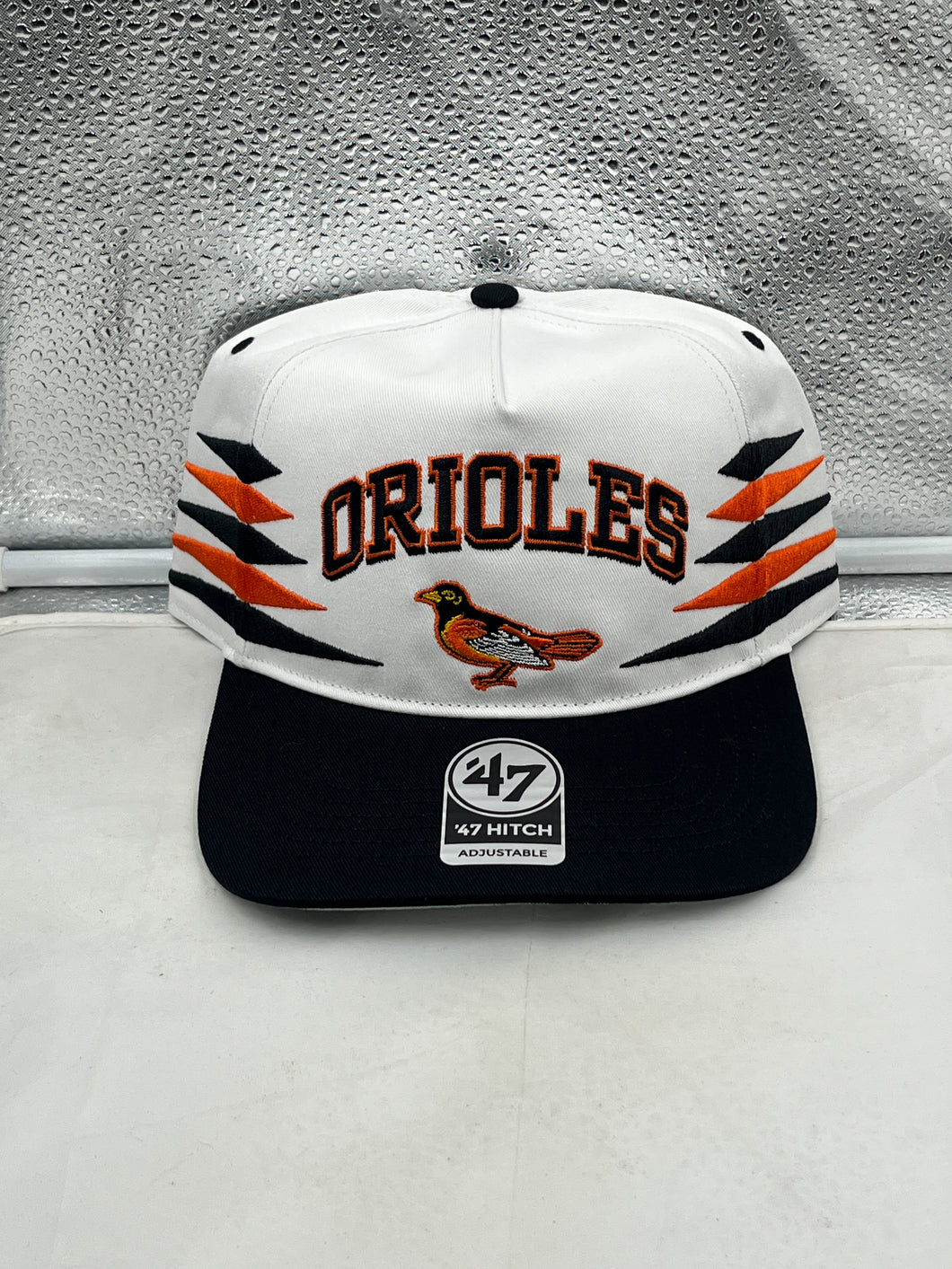 Baltimore Orioles MLB '47 Brand White Diamond Hitch Adjustable Snapback Hat showcasing a stylish design with the team logo and adjustable strap for a perfect fit.