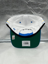 Load image into Gallery viewer, Close-up view of the UCLA Bruins NCAA &#39;47 Brand White Diamond Hitch Snapback Adjustable Hat, showcasing the logo and diamond pattern.
