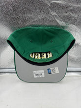 Load image into Gallery viewer, Oregon Ducks NCAA &#39;47 Brand Green Hitch City Line Adjustable Snapback Hat being worn by a fan at a game, demonstrating team spirit and comfort in an Oregon Ducks hat.
