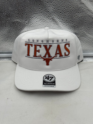 Texas Longhorns NCAA '47 Brand White Hitch City Line Adjustable Snapback Hat displayed outdoors, ideal for showing team spirit.