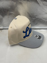 Load image into Gallery viewer, Lifestyle image of a fan wearing the Detroit Lions NFL &#39;47 Brand Natural TT Script Hitch Snapback Adjustable Hat outdoors.

