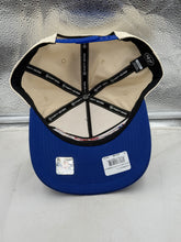 Load image into Gallery viewer, Buffalo Bills NFL &#39;47 Brand Natural TT Script Hitch Snapback Adjustable Hat displayed on a table, highlighting the natural color scheme and stylish design, essential for every Buffalo Bills hat collection.
