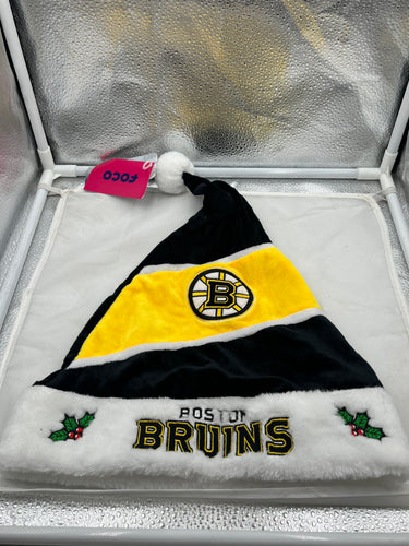Boston Bruins NHL Santa Hat Forever Collectibles featuring the iconic Boston Bruins logo, designed for holiday cheer, perfect for fans showing team spirit during the festive season.
