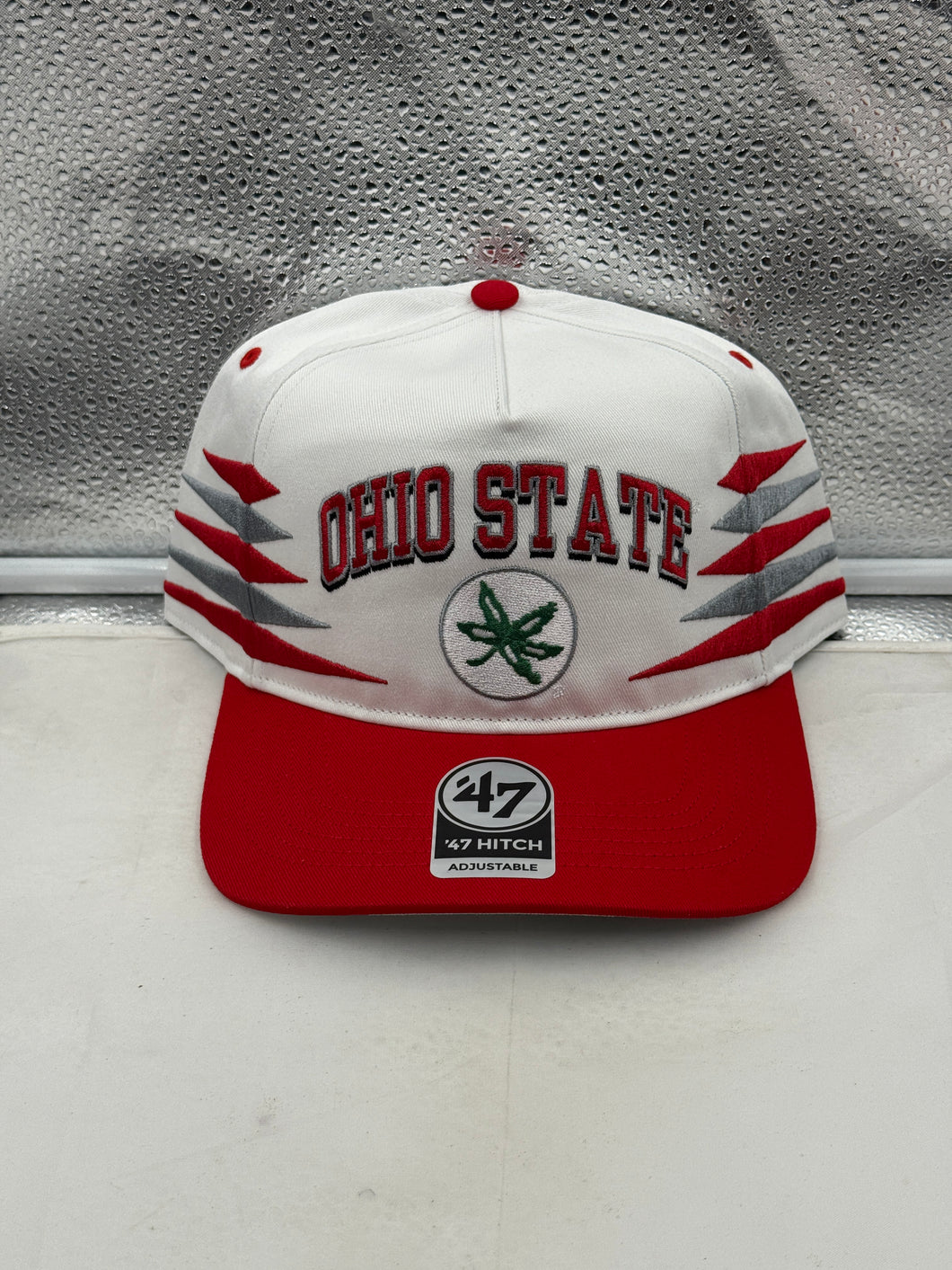 Ohio State Buckeyes NCAA '47 Brand White Diamond Hitch Snapback Adjustable Hat displayed on a model outdoors, showcasing team spirit and style.