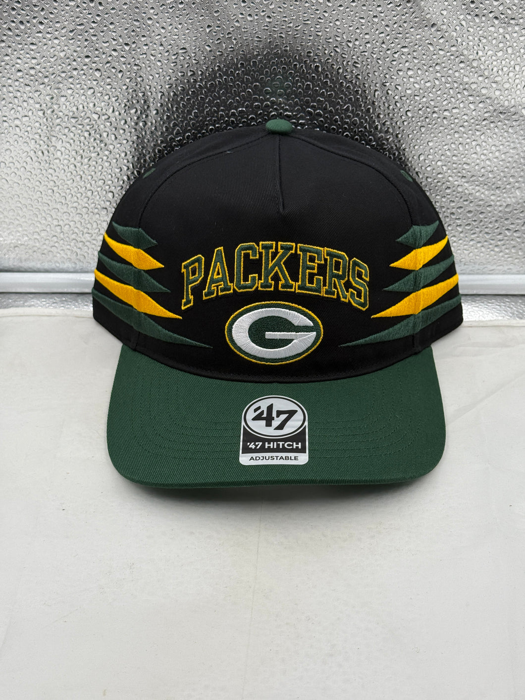 Green Bay Packers NFL '47 Brand Black TT Diamond Hitch Snapback Adjustable Hat view showing the sleek black design and diamond hitch detailing.