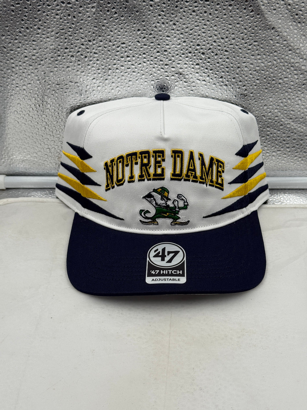 Notre Dame Fighting Irish NCAA '47 White Diamond Hitch Snapback Adjustable Hat showcasing the trendy diamond pattern and classic team logo, perfect for game day or casual wear.