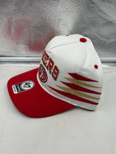 Load image into Gallery viewer, Close-up view of the San Francisco 49ers NFL &#39;47 Brand White TT Diamond Hitch Snapback Adjustable Hat highlighting the iconic 49ers logo and quality craftsmanship.
