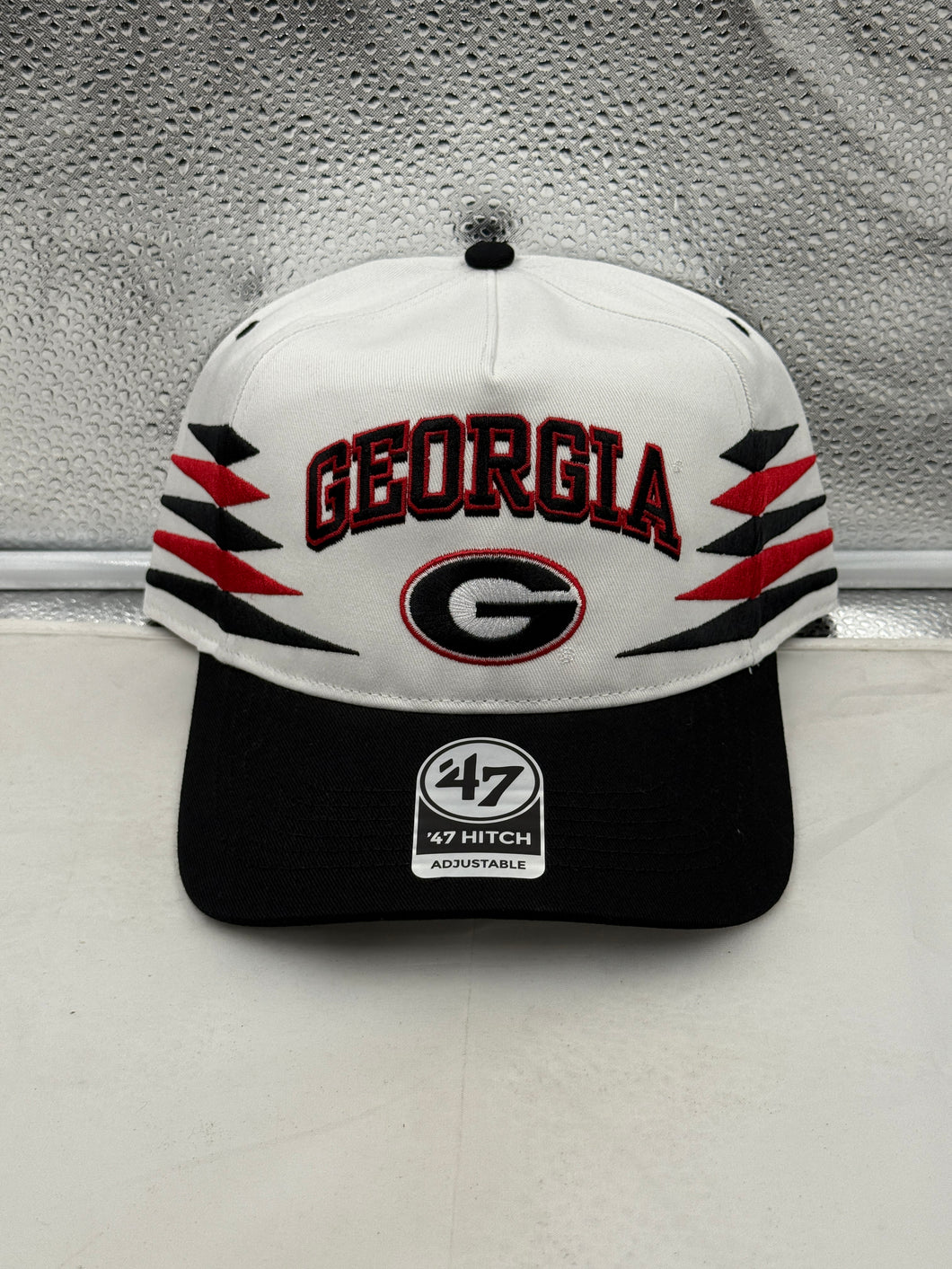 Georgia Bulldogs NCAA '47 Brand White TT Diamond Hitch Snapback Adjustable Hat displayed from a side angle, emphasizing the adjustable fit and iconic team logo.