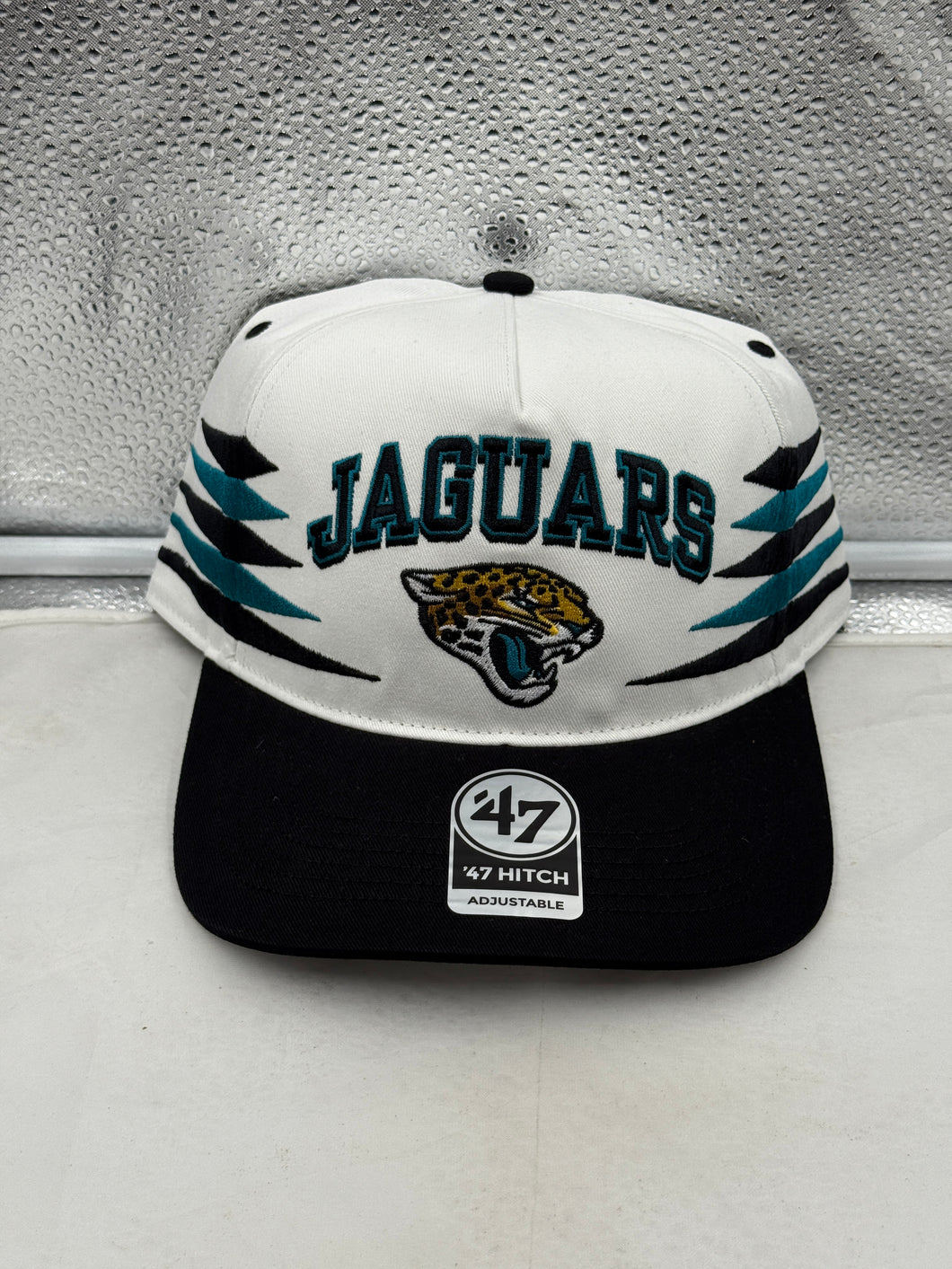 Jacksonville Jaguars NFL '47 Brand White Diamond Hitch Snapback Adjustable Hat showcasing the team's logo and diamond hitch pattern in vibrant colors.
