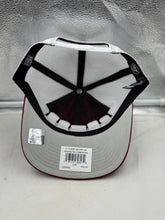 Load image into Gallery viewer, Lifestyle shot featuring the Washington Commanders NFL '47 Brand Red Trucker Mesh Strapback Adjustable Hat being worn at a game, reflecting fan enthusiasm.
