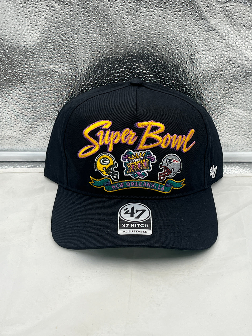 Packers Vs Patriots 1996 Super Bowl Dueling NFL '47 Black Hitch Adjustable Hat showcasing team logos and classic design.