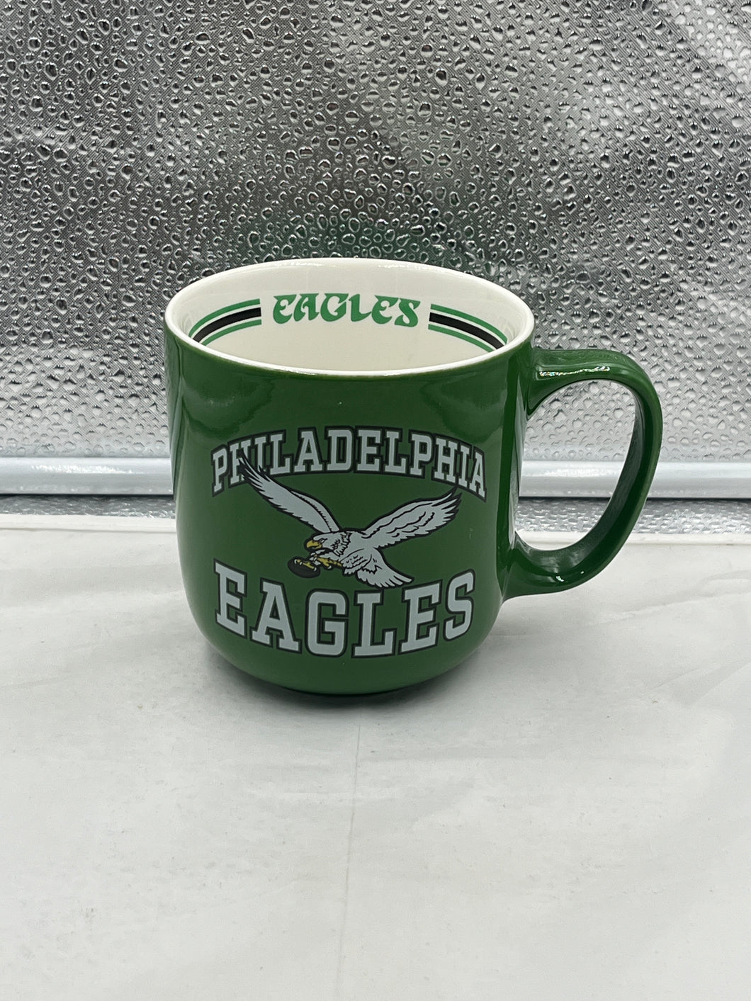 Philadelphia Eagles Throwback NFL 15oz Coffee Mug showcasing the classic throwback logo, perfect for coffee or tea enthusiasts and fans of the Philadelphia Eagles.