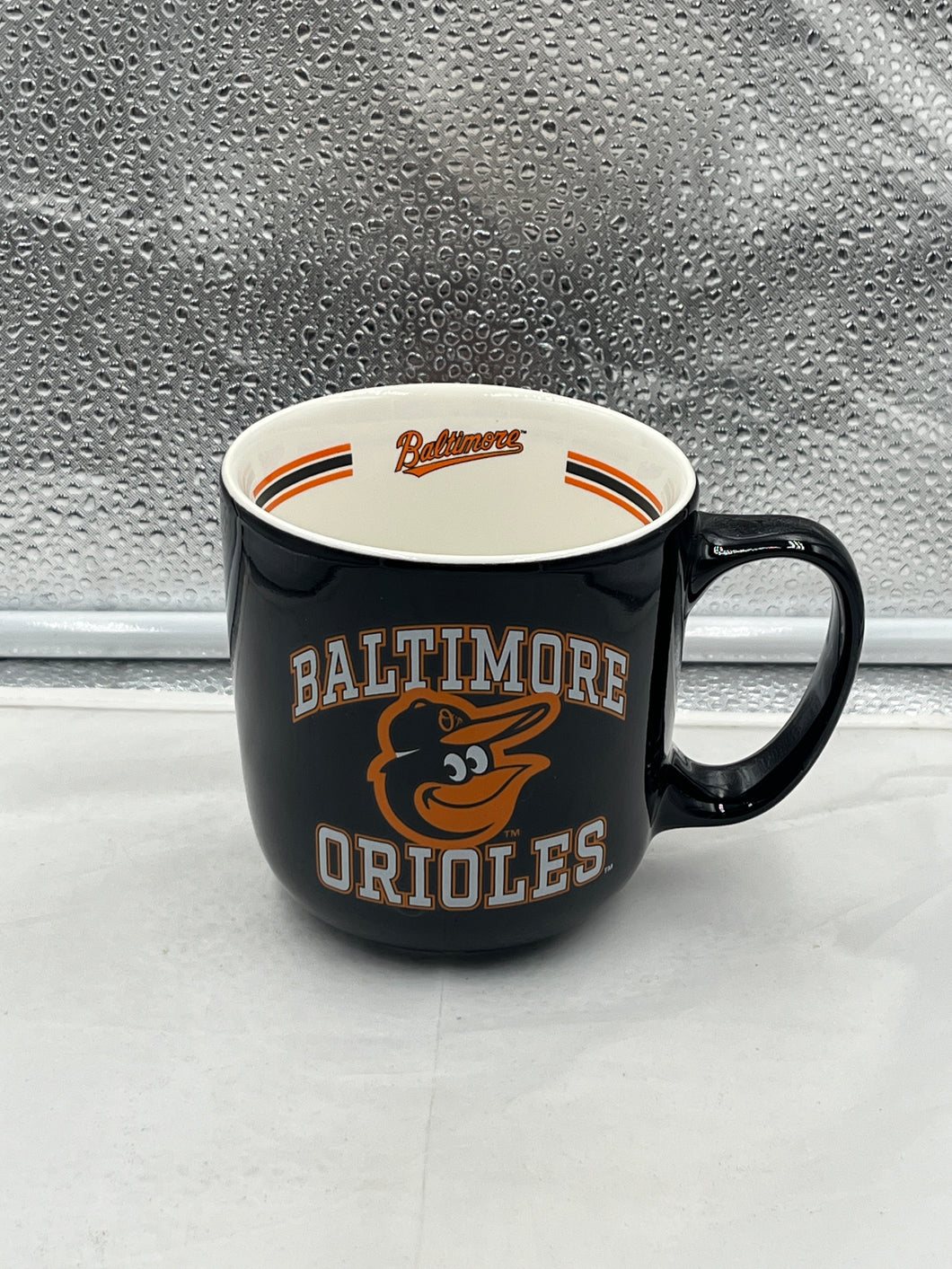 Baltimore Orioles MLB 15oz Coffee Mug showcasing the official team logo by Logo Brands, perfect for coffee, tea, and hot beverages.