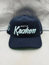 Load image into Gallery viewer, Seattle Kraken NHL '47 Brand Corduroy Navy Hitch Adjustable Snapback Hat displayed on a neutral background showcasing its vintage-inspired design and bold team branding.
