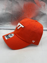 Load image into Gallery viewer, Close-up of the Virginia Tech Hokies NCAA '47 Brand Orange Clean Up Adjustable Strapback Hat featuring adjustable strapback closure and official NCAA team logo.
