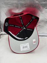 Load image into Gallery viewer, Model wearing the Alabama Crimson Tide hat at a football game, displaying true team spirit and style in a casual outfit.
