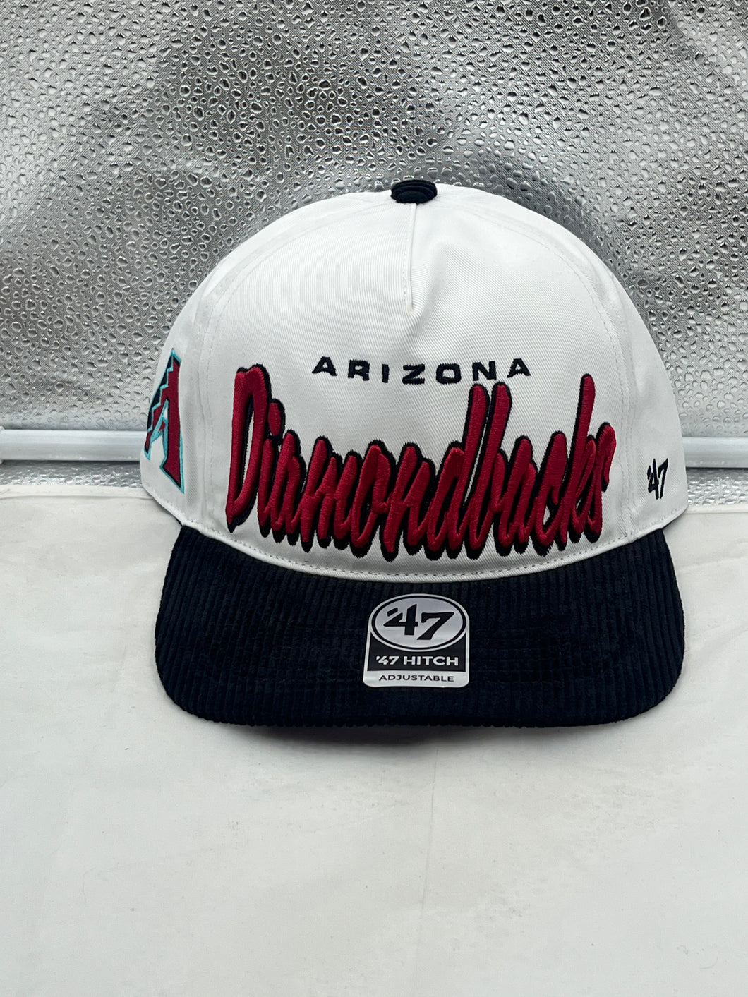Arizona Diamondbacks MLB '47 White Two Tone Script Hitch Adjustable Snapback Hat displayed on a mannequin, showcasing the stylish design and adjustable fit.