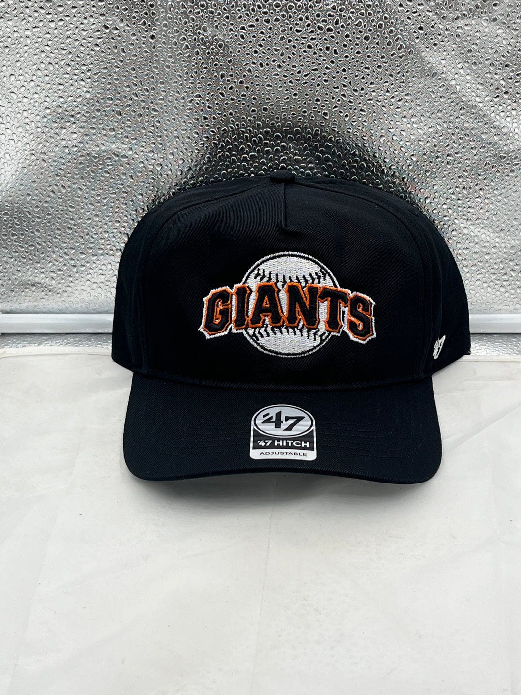 San Francisco Giants MLB '47 Brand Throwback Black Hitch Adjustable Snapback Hat displayed on a model, showcasing its stylish design and iconic logo.