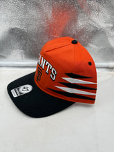 Load image into Gallery viewer, Side profile of the San Francisco Giants MLB '47 Brand Orange Diamond Hitch Adjustable Snapback Hat featuring adjustable snapback closure for versatile fit.
