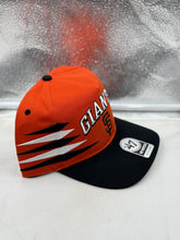 Load image into Gallery viewer, Close-up of San Francisco Giants MLB '47 Brand Orange Diamond Hitch Adjustable Snapback Hat showing intricate logo details and quality materials.
