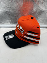 Load image into Gallery viewer, Baltimore Orioles MLB '47 Brand Orange TT Diamond Hitch Adjustable Snapback Hat tilted view highlighting the adjustable snapback strap and stylish design.
