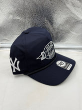 Load image into Gallery viewer, Model wearing the New York Yankees MLB '47 Brand Navy Hitch Rope Adjustable Snapback Hat at a sporting event.
