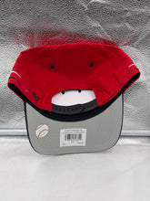 Load image into Gallery viewer, Cleveland Guardians MLB '47 Brand Red TT Diamond Hitch Adjustable Snapback Hat worn by a fan at a baseball game.
