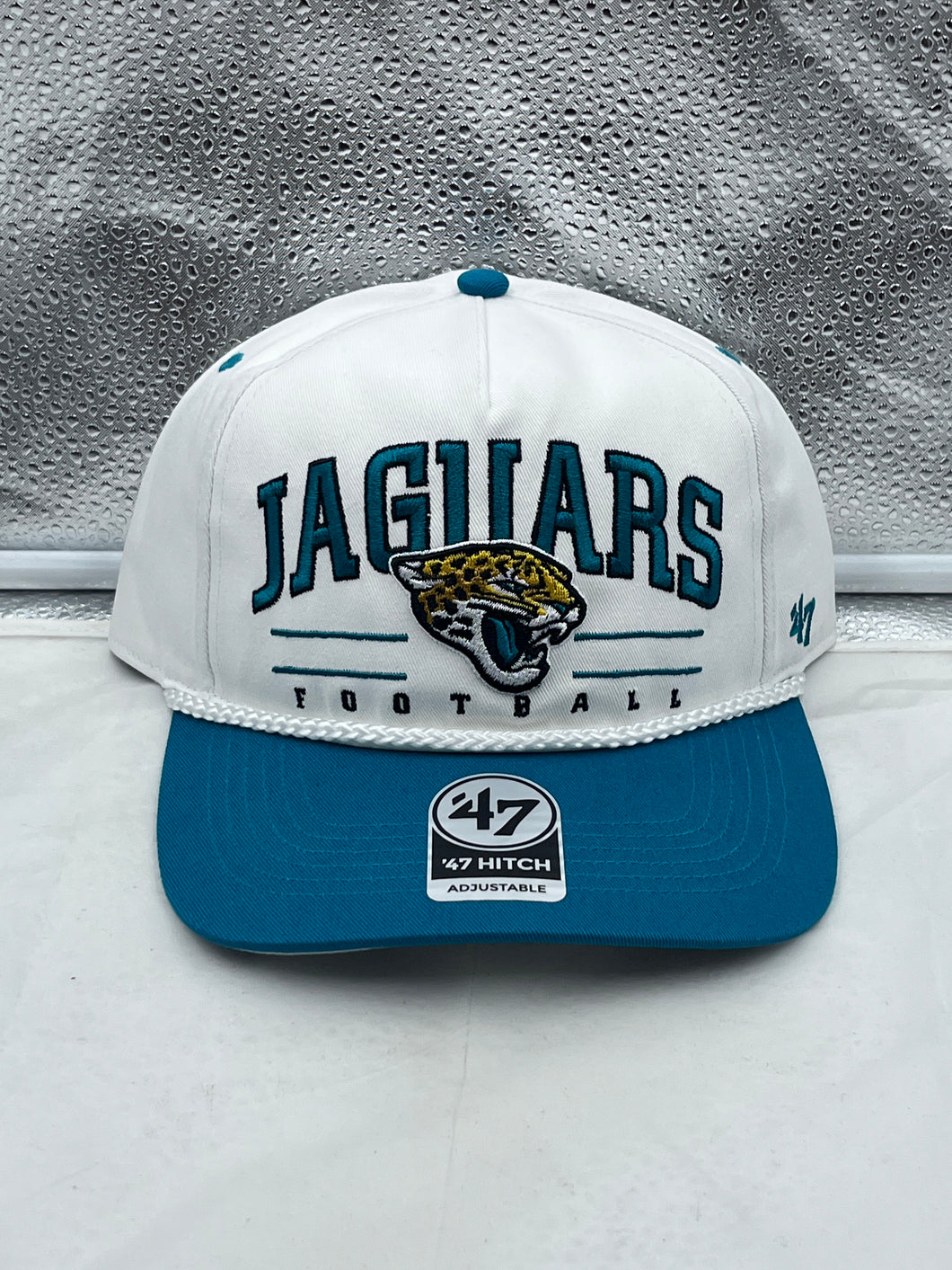 Jacksonville Jaguars NFL '47 White TT Roscoe Hitch Rope Snapback Adjustable Hat displayed on a simple background, highlighting its stylish design and iconic team logo.