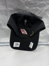 Load image into Gallery viewer, Stylish Carolina Hurricanes NHL '47 Brand Clean Up Black Adjustable Hat worn by a fan during a game, demonstrating team spirit.
