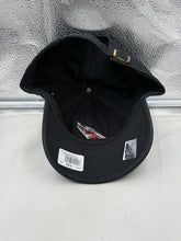 Load image into Gallery viewer, Flat lay of the Carolina Hurricanes NHL '47 Brand Clean Up Black Adjustable Hat displaying the classic design and team logo.
