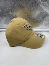 Load image into Gallery viewer, UCF Golden Knights NCAA '47 Brand Gold Clean Up Adjustable Strapback Hat modeled by a fan, demonstrating team spirit and comfort.
