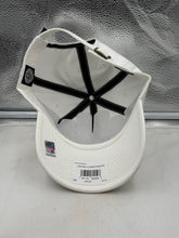 Load image into Gallery viewer, UCF Golden Knights NCAA '47 Brand White Clean Up Adjustable Strapback Hat worn by a fan at a sporting event, showcasing team spirit.
