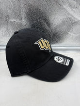 Load image into Gallery viewer, UCF Golden Knights NCAA '47 Brand Black Clean Up Adjustable Strapback Hat worn by a fan at a sporting event.
