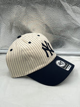 Load image into Gallery viewer, a new york yankees baseball cap sitting on a window sill
