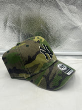 Load image into Gallery viewer, a new york yankees camo hat sitting on a window sill
