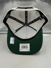 Load image into Gallery viewer, Lifestyle shot of a fan wearing the Minnesota Wild NHL '47 Brand White Two Tone Script Hitch Adjustable Snapback Hat during a game, showcasing its versatility as a Minnesota Wild hat.
