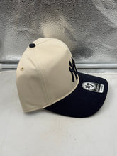 Load image into Gallery viewer, A person styling the New York Yankees MLB '47 Brand Natural TT Hitch Adjustable Snapback Hat, perfect for casual outings or game days as a standout New York Yankees hat.
