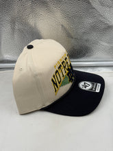 Load image into Gallery viewer, Notre Dame Fighting Irish hat displayed outdoors, highlighting its versatility for casual outings and game day.
