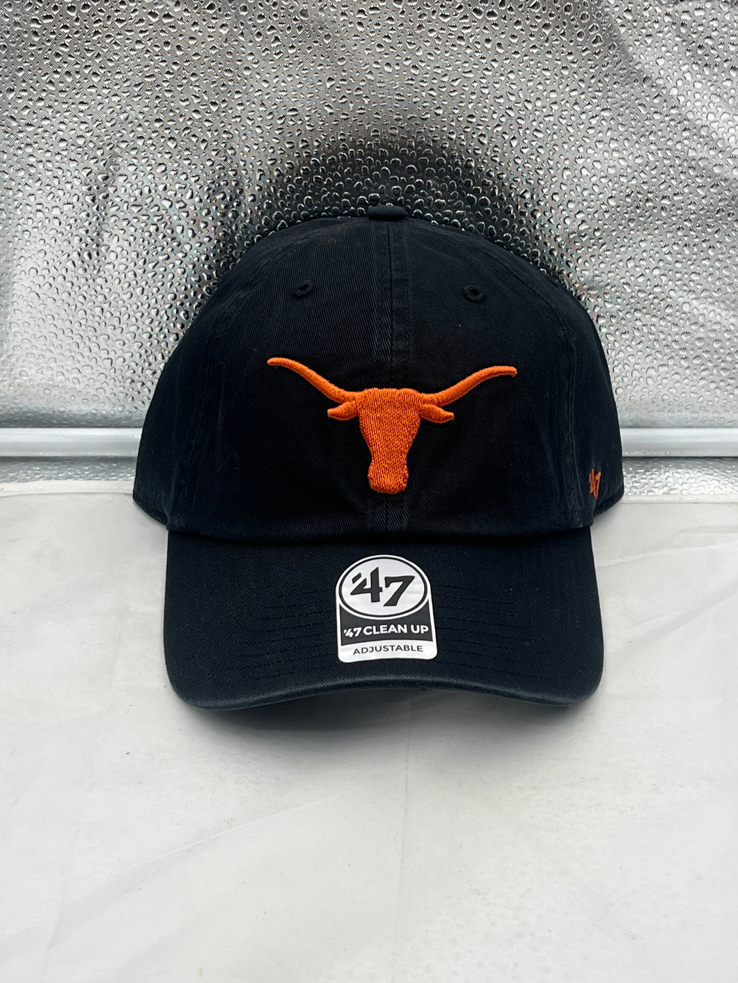 Texas Longhorns NCAA '47 Brand Black Clean Up Adjustable Strapback Hat displayed from the front, showcasing the iconic logo and stylish design.