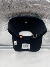 Load image into Gallery viewer, Texas Longhorns NCAA &#39;47 Brand Black Clean Up Adjustable Strapback Hat worn by a fan at a game, representing school pride in the stands.
