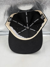 Load image into Gallery viewer, Miami Hurricanes hat styled with casual wear, demonstrating its versatility for various occasions while representing the Miami Hurricanes.
