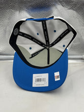 Load image into Gallery viewer, Lifestyle image of a person wearing the Ole Miss Rebels NCAA '47 Brand White TT Hitch Adjustable Snapback Hat at a game, showcasing team spirit and style.
