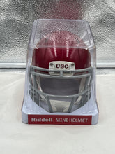 Load image into Gallery viewer, USC Trojans NCAA Red Riddell Speed Mini Helmet displayed on a shelf, perfect for displaying team pride and enhancing sports environment.
