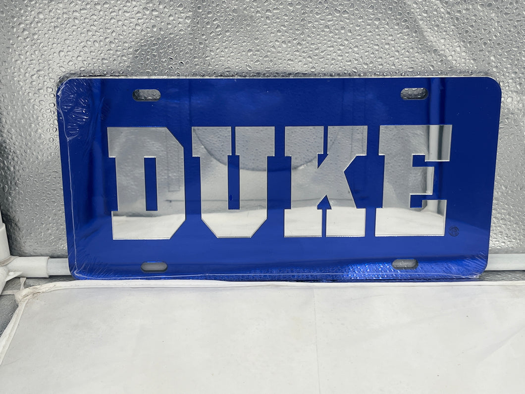 Duke Blue Devils NCAA Blue Mirrored Laser Cut License Plate from Craftique, showcasing the iconic logo with a stunning mirrored finish, perfect for displaying team pride on your vehicle.