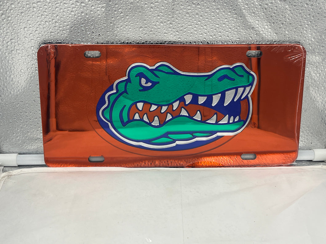 Florida Gators NCAA Orange Mirrored Laser Cut License Plate by Craftique, showcasing the vibrant orange mirrored finish and iconic Florida Gators logo, perfect for car accessories.