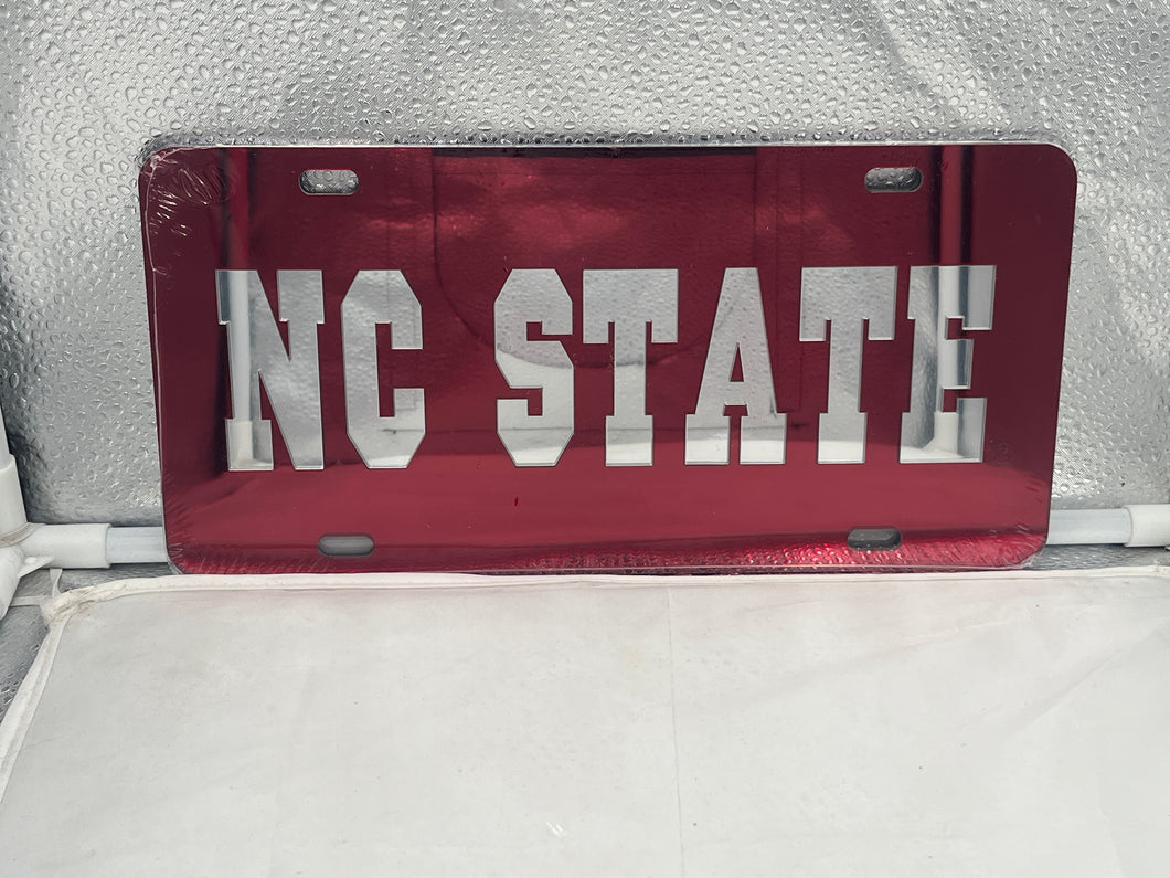 NC State Wolfpack NCAA Red Mirrored Laser Cut License Plate by Craftique, showcasing vibrant red color and high-quality craftsmanship, perfect for displaying team spirit on any vehicle.