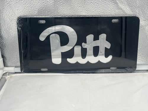 Pitt Panthers NCAA Black Mirrored Laser Cut License Plate from Craftique, featuring a striking black mirrored finish and detailed laser-cut logo, perfect for showcasing your team spirit while driving or as home decor.