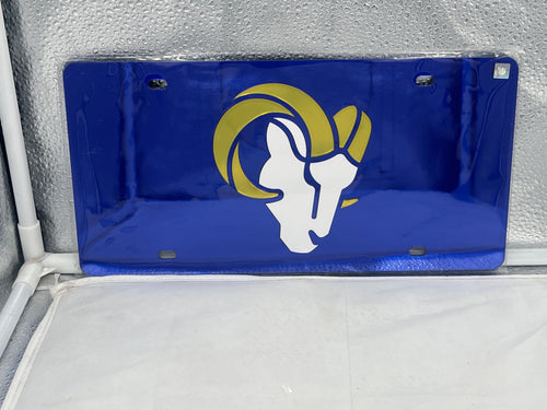Los Angeles Rams NFL Blue Reflective Lasercut License Plate by WinCraft showcasing a durable and stylish accessory for vehicles, featuring the Rams logo in an eye-catching reflective finish.